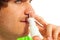 Young man with nasal spray