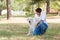 Young man with old senior labrador dog in the nature