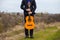 Young man with an orange guitar outdoors