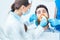 Young man during a painless oral procedure in the dental office