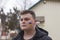 A young man with a painted Ukrainian yellow-blue flag on his cheek. Russia`s invasion of Ukraine