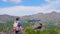 A young man pauses on a hiking trail to look at the view.  Outdoor Activities Travel Concept Man in Nature.