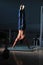 Young man performing handstand in fitness studio