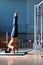 Young man performing handstand in fitness studio