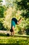 Young man performing handstand on the ground in the park