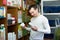 Young man with pet supplements in petshop