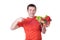 Young man with plate of fresh healthy vegetables