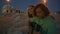 Young man play guitar music at night beach closeup. Teenagers romantic evening