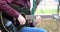 Young man playing acoustic guitar outdoors