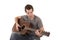 Young man playing acoustic guitar sitting