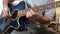 Young man playing blue guitar at home during the Covid-19 quarantine