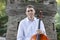 Young man playing cello outside. Cellist playing classical music on cello