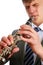 A young man playing the clarinet