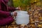 Young Man playing crystal bowls outdoors in the forest in the fall 4/12