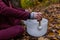 Young Man playing crystal bowls outdoors in the forest in the fall 8/12