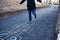 A young man playing hopscotch on asphalt. Good mood and spring in Russia. A bearded man recalls his childhood