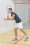 Young man playing indoor tennis