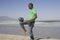 Young Man Playing Soccer On Beach