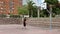 Young man playing on the street basketball court