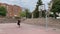 Young man playing on the street basketball court