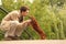 Young man plays with his adorable dachshund