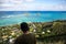 Young man point of view Lanikai from the Pillbox hiking trail Kailua Hawaii in December
