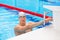 Young man in a pool - go to start swimming. backstroke during