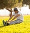 Young man portrait stretching after jogging