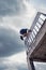 Young man practice parkour in ithe city summer day