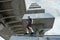 Young man practice parkour in ithe city summer day