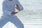 Young man practicing traditional Tai Chi Chuan, Tai Ji  and Qi gong in the park for healthy, traditional chinese martial arts