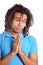 Young man praying against white background isolated