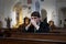 Young man praying in church