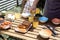 Young man preaparing table for outdoor dinner