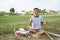 A young man is preparing a bamboo stick