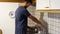 Young man preparing breakfast for himself