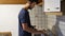 Young man preparing breakfast for himself