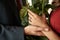 Young man presenting woman bunch of flowers