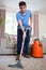 Young Man Professionally Cleaning Carpets