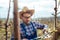 Young man pruning branches of fruit tree in springtime