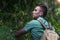 Young man pulls the girl`s hand on the forest path