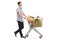 Young man pushing a shopping cart filled with groceries