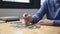 Young man puts the coins on the money bar or on the pile of money to keep for future use