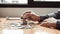 Young man puts the coins on the money bar or on the pile of money to keep for future use