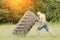 Young man raises tire. Workout