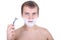 Young man with razor and shaving foam