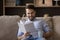 Young man reader holding cup of coffee enjoying favorite book