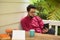 Young man with reader sitting outdoor