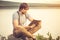 Young Man reading book outdoor