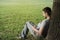 Young man reading e-book